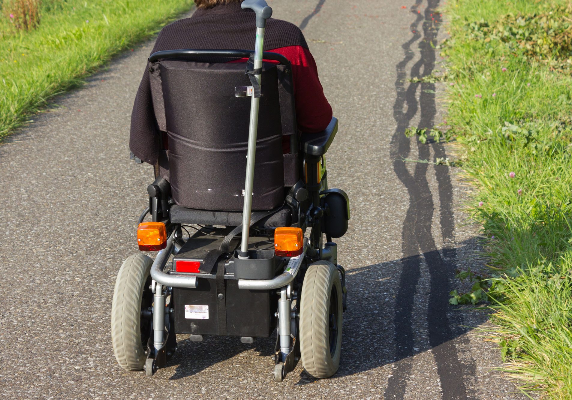 Mobility scooter with crutch aid